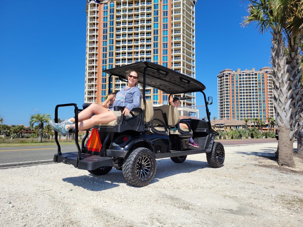 Family enjoying a Golf Cart at Pensacola Beach Florida
