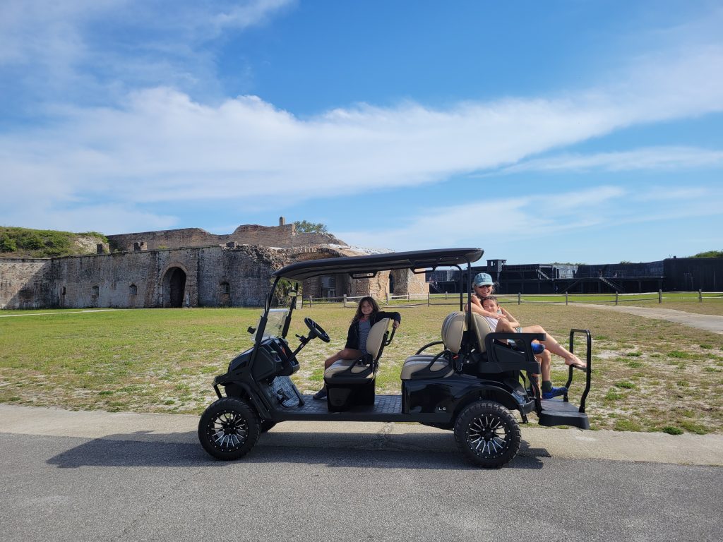 Visiting Fort Pickens at Pensacola Beach with a rented golf cart.